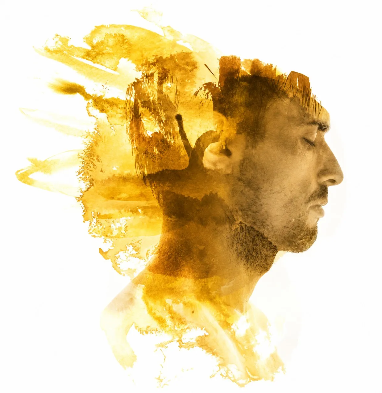 A man’s profile dissolving into warm yellow ink